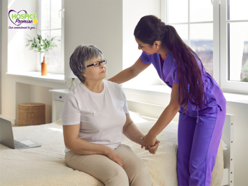 Hospice care assistant helping a patient.